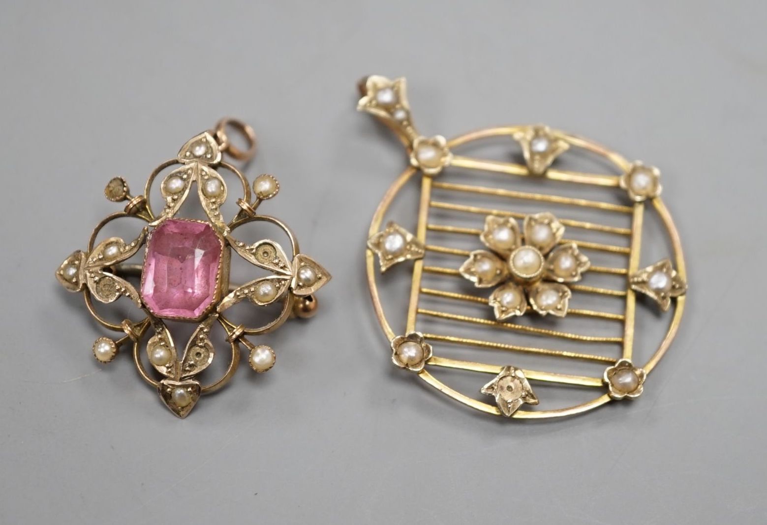 An Edwardian 9ct and seed pearl set circular pendant , 31mm and a similar pink paste and seed pearl set pendant brooch, gross 7.2 grams.